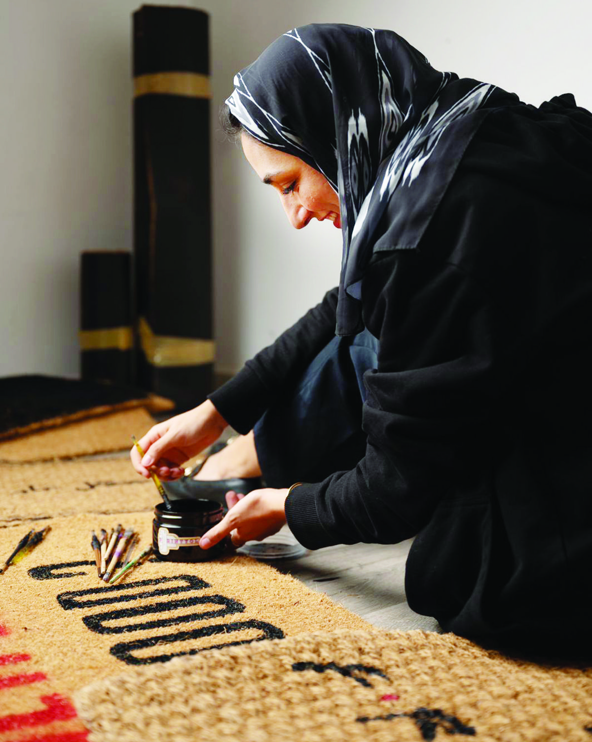 Raghda Turkistani paints on door mats, wood and other materials, including Persian and Arabian carpets. (Instagram/raghda.craft)