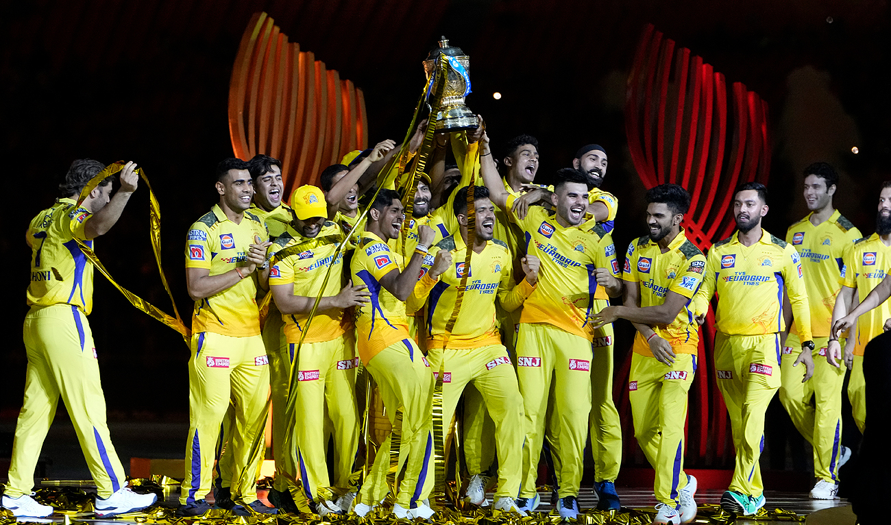 Players of Chennai Super Kings celebrate with the winners trophy after their win in the Indian Premier League final cricket match against Gujarat Titans in Ahmedabad, India, Tuesday, May 30, 2023. (Photo courtesy: AP)