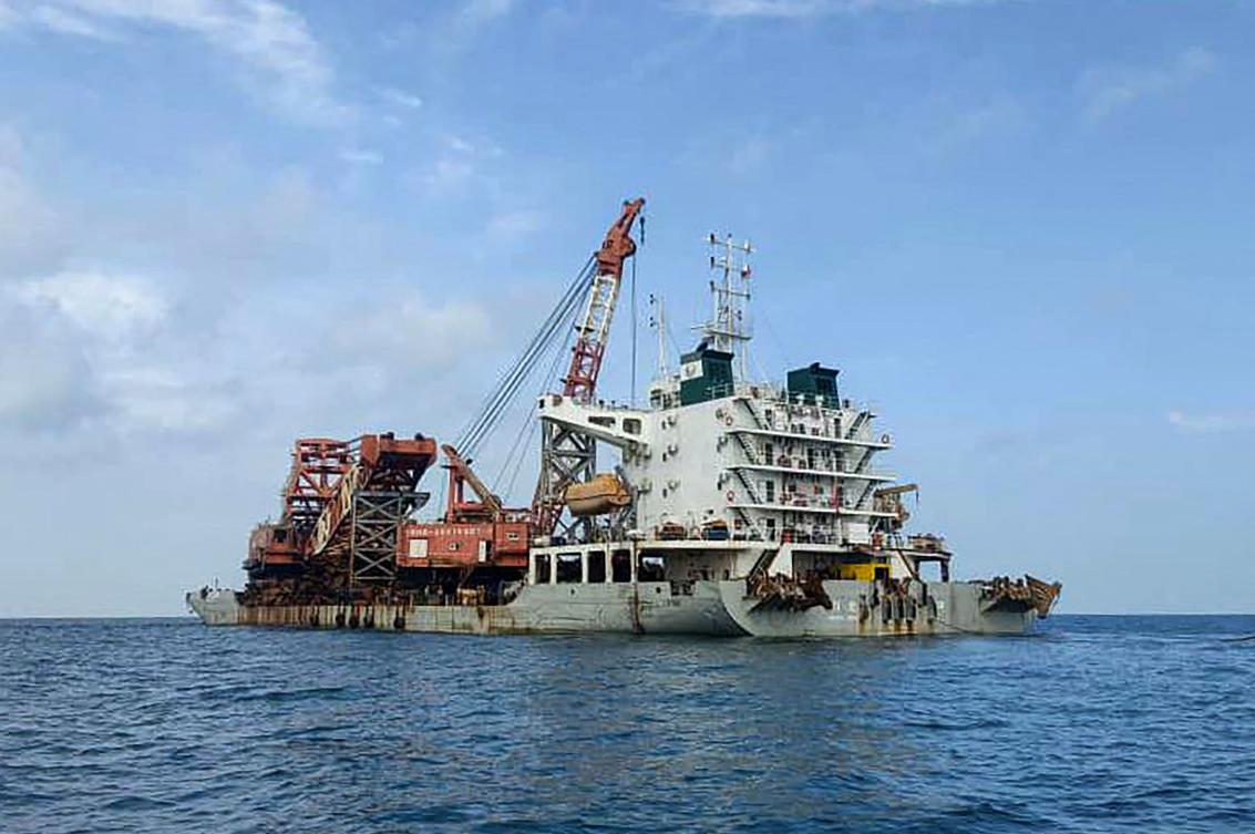 Above, the Chinese vessel anchored near Tanjung Siang on the waters of the Malaysia’s Johor state after its crew was detained on suspicion of looting two British World War II shipwrecks. (Malaysian Maritime Enforcement Agency/AFP)