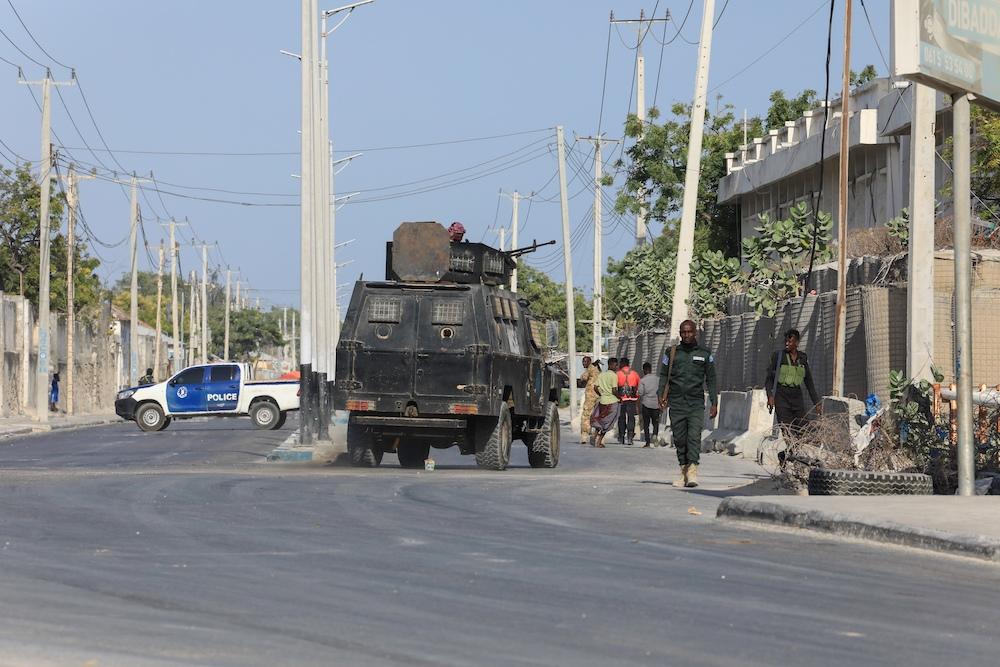 The Al-Shabab insurgent group has been fighting since 2006 to topple Somalia’s central government and establish its own rule based on its strict interpretation of Islamic law. Above, security forces patrol outside a building which was attacked by suspected Al-Shabab militants in Mogadishu on Feb. 21, 2023. (AFP file photo)