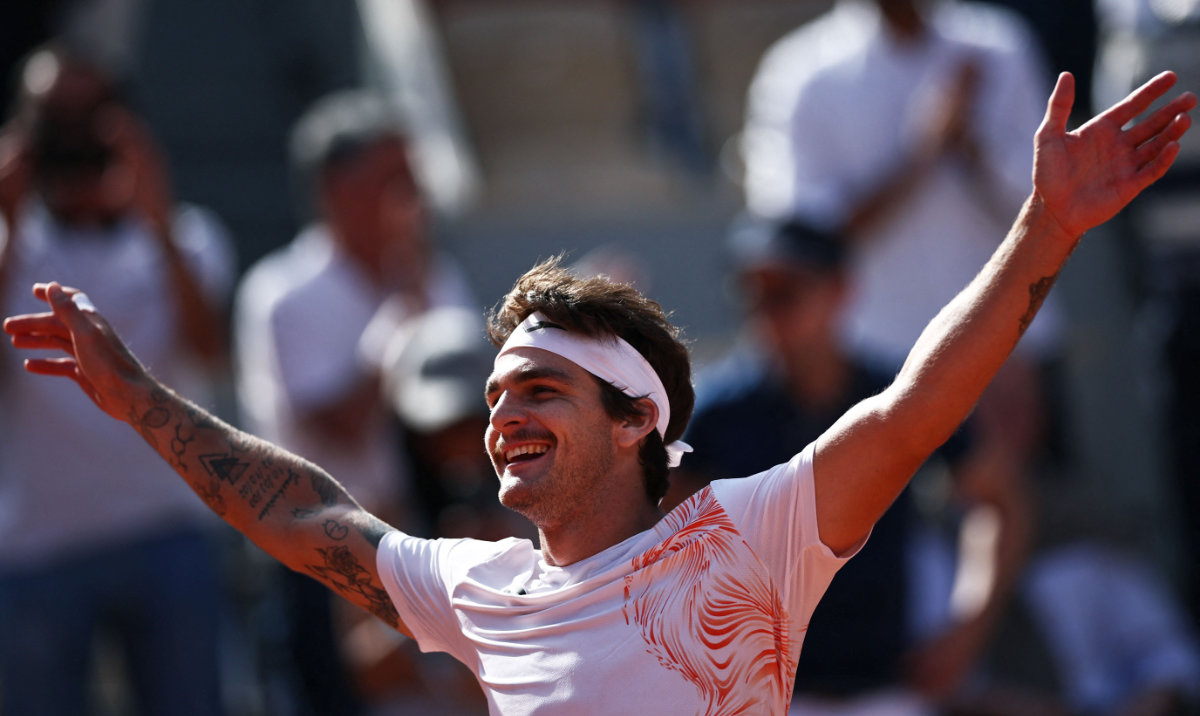 Brazil's Thiago Seyboth Wild celebrates after victory against Russia's Daniil Medvedev during their men's singles match on day three of the Roland-Garros Open tennis tournament at the Court Philippe-Chatrier in Paris on Tuesday. (AFP)