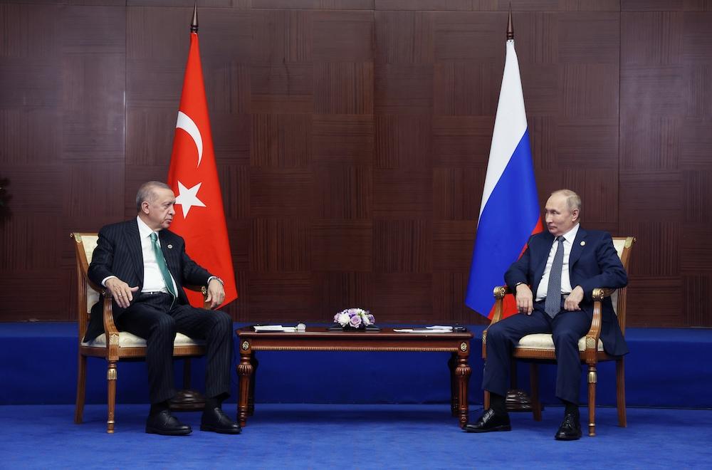 President Vladimir Putin and his Turkish counterpart Recep Tayyip Erdogan meet on the sidelines of the Sixth Summit of the Conference on Interaction and Confidence Building Measures in Asia in Astana on Oct. 13, 2022. (Sputnik/AFP)