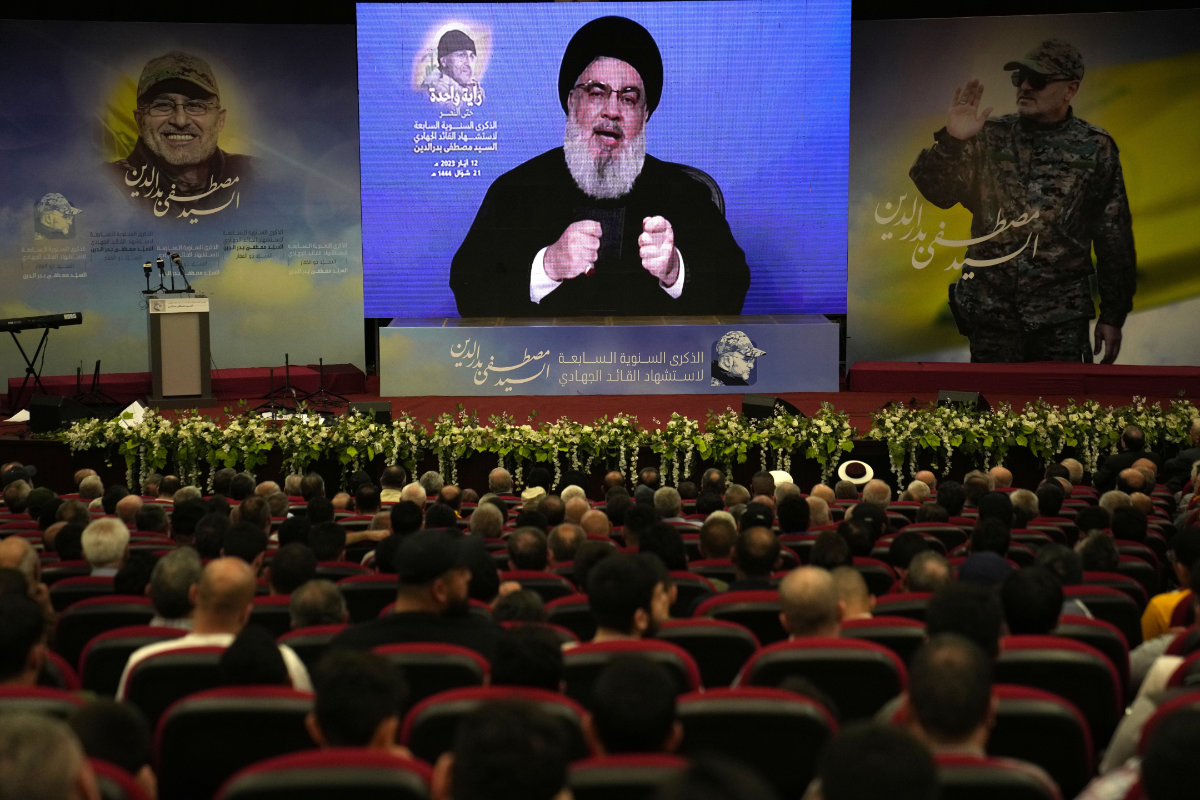 Hezbollah leader Sayyed Hassan Nasrallah speaks via a video link in the southern suburbs of Beirut, on, May 12, 2023. (AP)