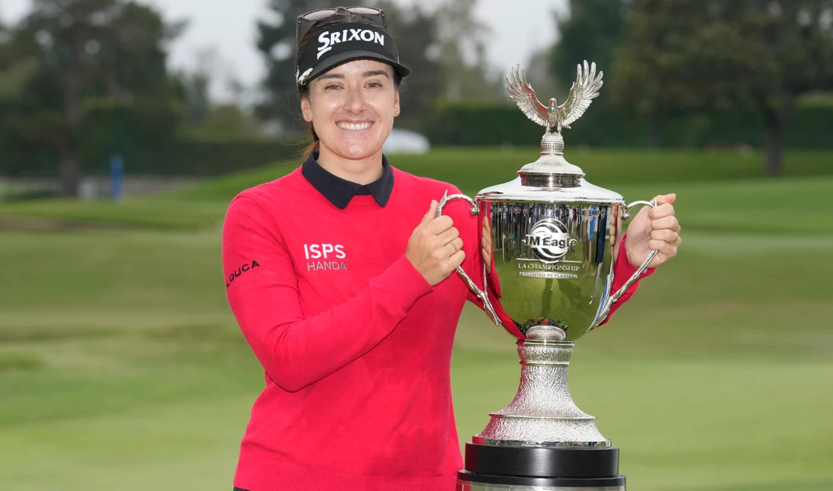 Hannah Green poses for photos with the winner's trophy after winning in a playoff in the LPGA LA Championship golf tournament at Wilshire Country Club Sunday in Los Angeles. (AP)