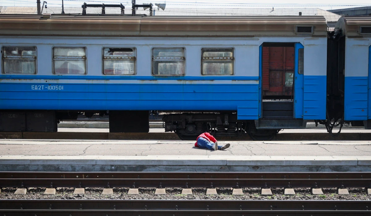 A casualty lies on the platform in the aftermath of a rocket attack on the railway station in the eastern city of Kramatorsk, in the Donbass region on April 8, 2022. (AFP)