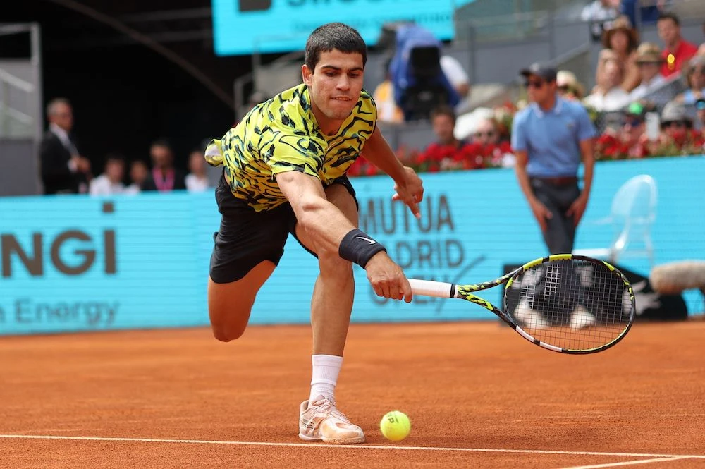 Spain’s Carlos Alcaraz returns the ball to Germany’s Alexander Zverev during their 2023 ATP Tour Madrid Open tennis tournament singles match at Caja Magica in Madrid on Tuesday. (AFP)