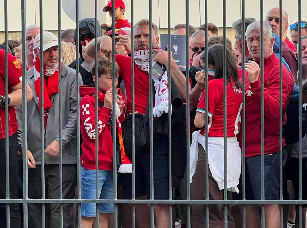 Liverpool fans react as they queue to access Stade de France before the Champions League Final against Real Madrid in Paris on May 28, 2022. (Reuters)