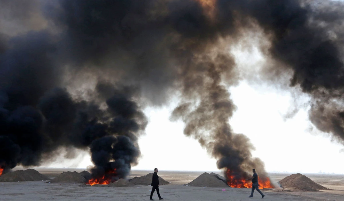 Iraqi government officials destroy nearly six tons of drugs, some of which had been in storage for more than a decade, in Baghdad's Nahrawan area on December 18, 2022. (AFP)