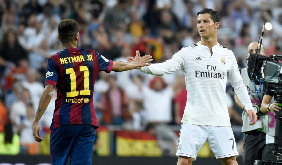 Barcelona's Brazilian forward Neymar da Silva Santos Junior (L) congratulates Real Madrid's Portuguese forward Cristiano Ronaldo on winning after the Spanish league "Clasico" football match Real Madrid CF vs FC Barcelona at the Santiago Bernabeu stadium in Madrid on October 25, 2014. Real Madrid won the match 3-1. (AFP)