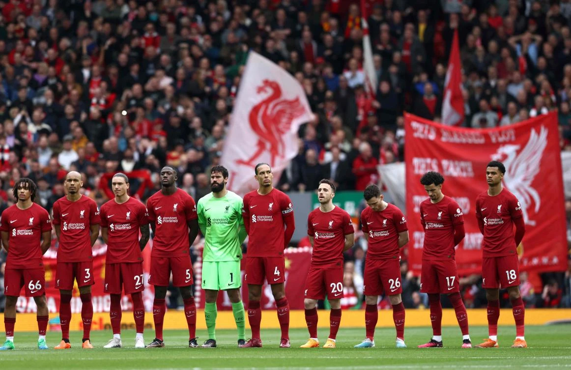Liverpool’s players sing the national anthem prior to their Premier League match against Brentford at Anfield in Liverpool on May 6, 2023. (AFP)