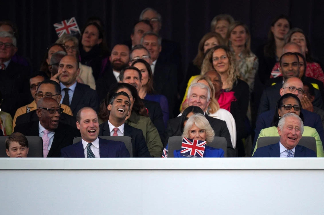 (1st row left to right) Prince George, the Prince of Wales, Queen Camilla and King Charles III (2nd row, 2nd from left) and Prime Minister Rishi Sunak in the Royal Box viewing the Coronation Concert held in the grounds of Windsor Castle, Berkshire, to celebrate the coronation of King Charles III and Queen Camilla. Picture date: Sunday May 7, 2023. (REUTERS)