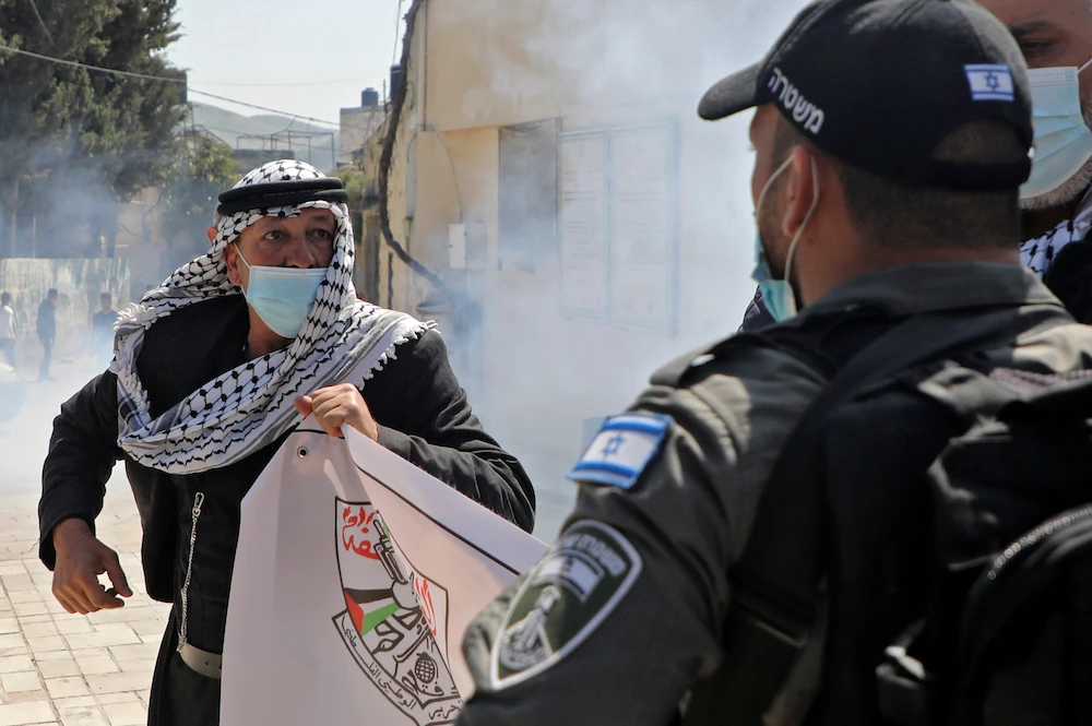 A Palestinian demonstrator rallies against settlers' visit to historical sites in the Palestinian village of Sebastia, Nablus. (File/AFP)