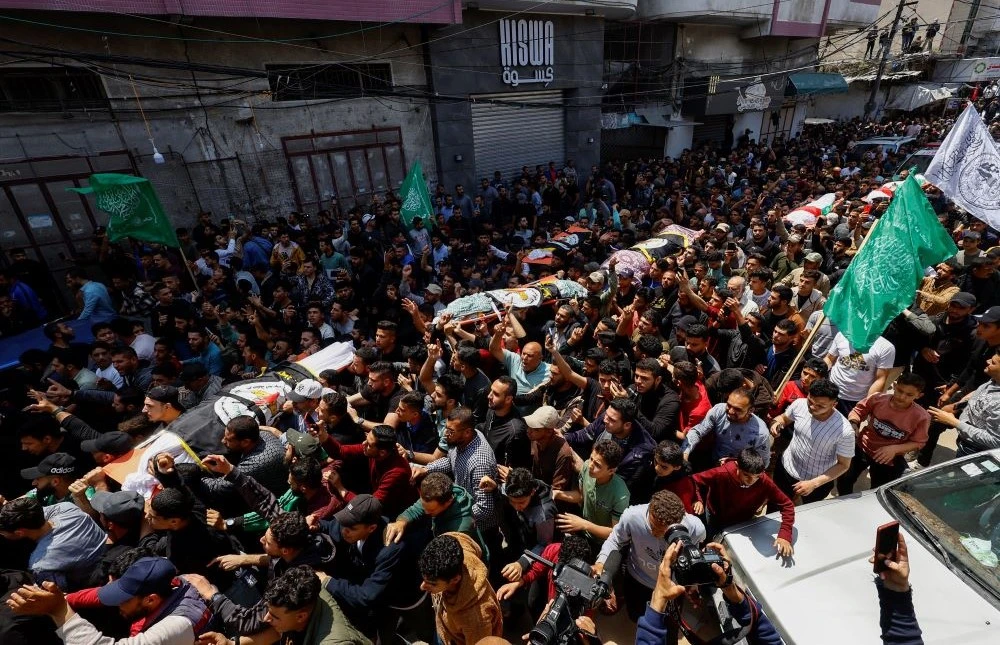 Mourners attend the funeral of Islamic Jihad commanders Tareq Izzeldeen and Khalil Al-Bahtini, and other Palestinians who were killed in Israeli strikes, Gaza City, May 9, 2023. (Reuters)