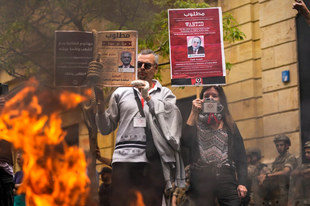 Angry protesters burn ATM at bank in Beirut