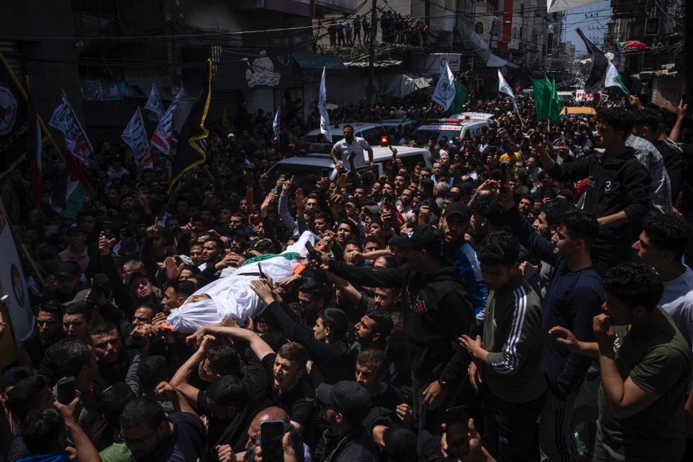 Image Caption : Mourners carry the bodies of Palestinians who were killed in Israeli airstrikes, during their funeral in Gaza City, Tuesday, May 9, 2023. (AP)
