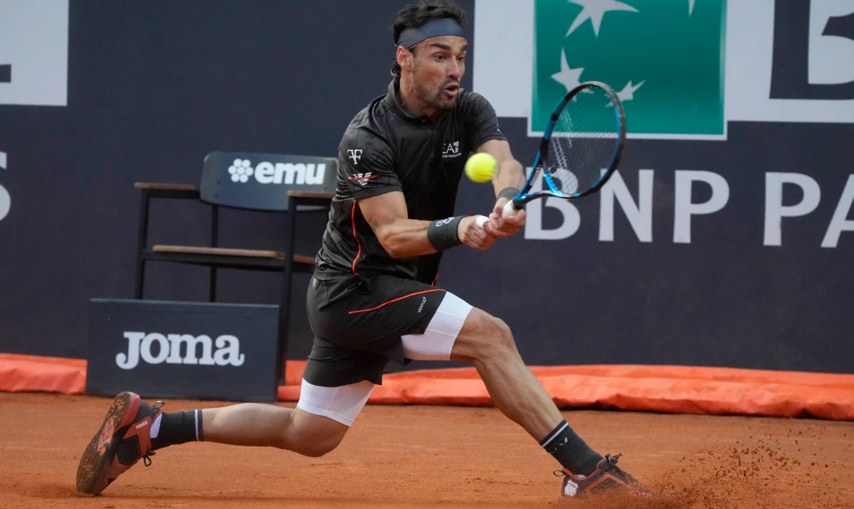Italy's Fabio Fognini returns the ball to Britain's Andy Murray during their match at the Italian Open tennis tournament, in Rome, Wednesday. (AP)