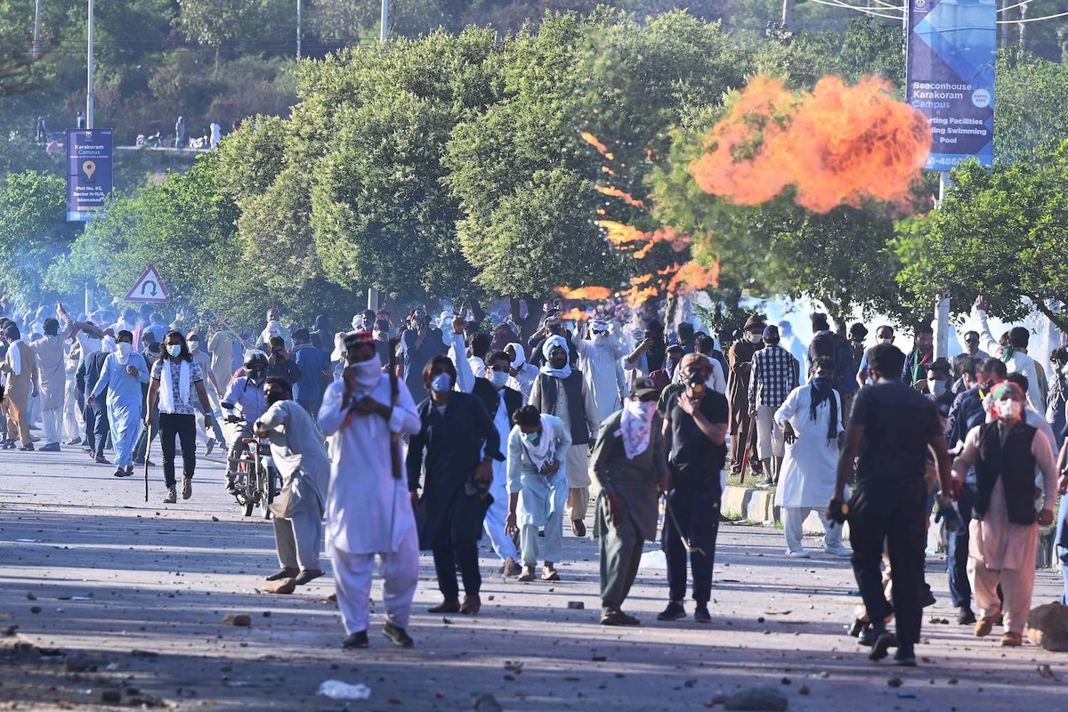 PTI party activists and supporters of former Pakistan’s Prime Minister Imran clash police during a protest outside the police headquarter where Khan is in custody, in Islamabad on May 10, 2023. (AFP)