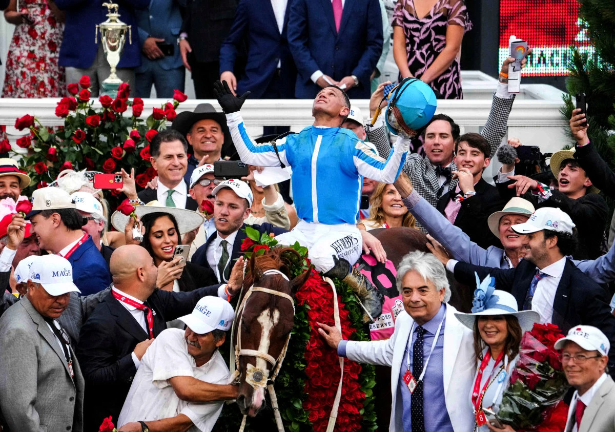 Jockey Javier Castellano aboard Mage in the winner's circle alongside trainer Gustavo Delgado , with a hand on the garland of roses, after the 149th running of Kentucky Derby last week at Churchill Downs in Louisville, Kentucky. (USA TODAY Sports)