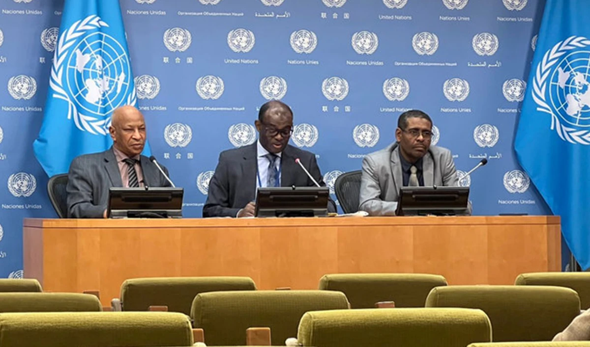 Sudan's UN envoy Al-Harith Idriss Al-Harith Mohamed (center), addresses a press conference at the United Nations headquarters on developments in Sudan on Friday. (Photo courtesy: @SudanMissionUN/Twitter)