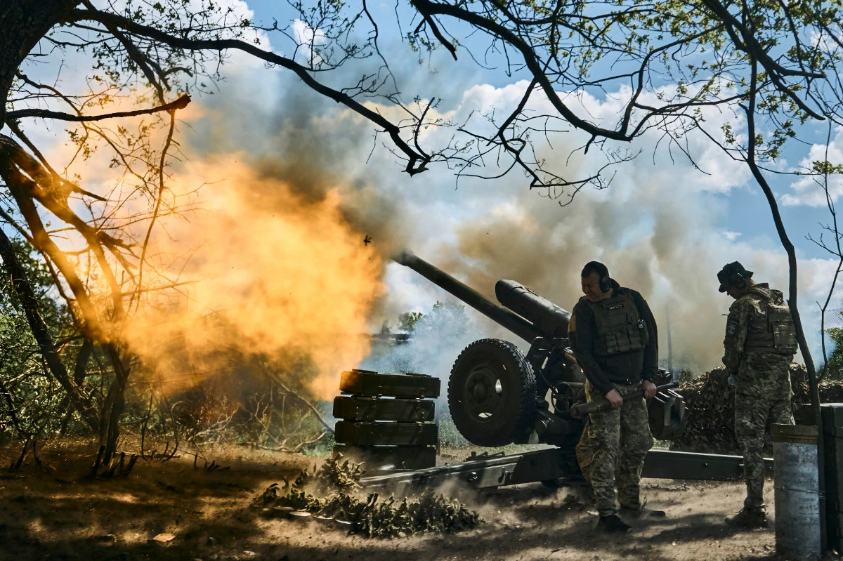 Ukrainian soldiers fire a cannon near Bakhmut, an eastern city where fierce battles against Russian forces have been taking place, in the Ukraine's Donetsk region on May 12, 2023. (AP)