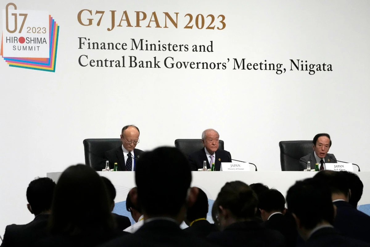Japanese Finance Minister Shunichi Suzuki, center, and Governor of the Bank of Japan Kazuo Ueda, right, attend the presidency press conference at the G7 meeting at Toki Messe in Niigata, Japan, Saturday, May 13, 2023. (AP / Pool Photo)