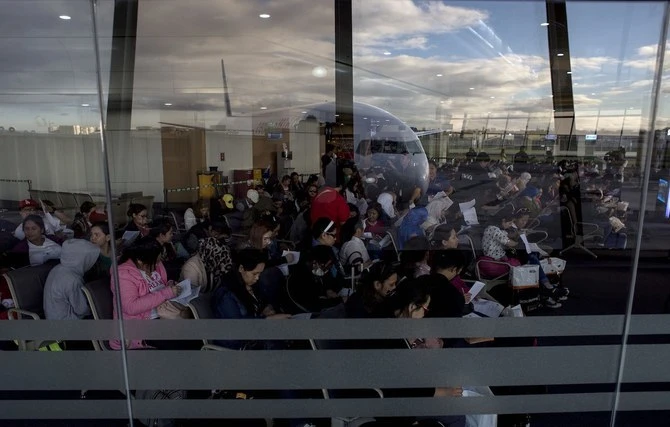 Filipino workers returning home from Kuwait arrive at Manila International Airport. (AFP/File)