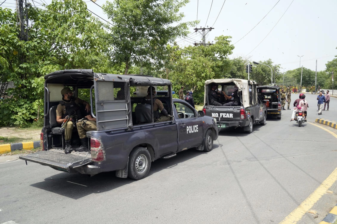 Police personnel patrol around the residence of Pakistan’s Imran Khan in Lahore as they keep up their siege around the home of the former prime minister. (AP)
