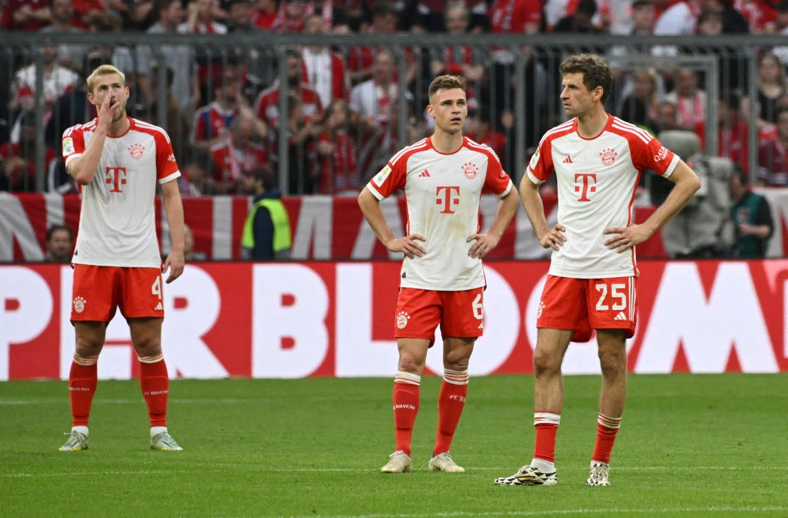 Bayern Munich’s Thomas Mueller, Joshua Kimmich and Matthijs de Ligt look dejected after conceding their third goal during their Bundesliga match against RB Leipzig at Allianz Arena on May 20, 2023. (Reuters)