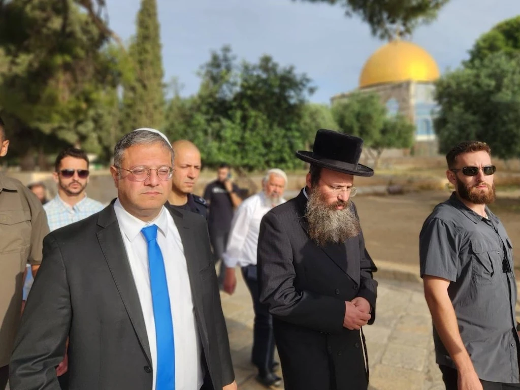 Israel's National Security Minister Itamar Ben-Gvir (L) walking through the courtyard of Jerusalem's Al-Aqsa mosque complex, known to Jews as the Temple Mount, early on May 21, 2023. (AFP)