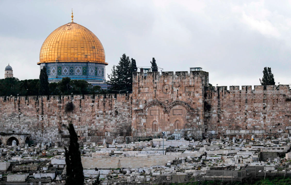 This picture taken on January 24, 2020 shows a view of (front) the Golden Gate, also known as the Gate of Mercy, that is part of the Old City of Jerusalem's walls, with the Dome of the Rock at al-Aqsa mosque compound behind. (AFP)
