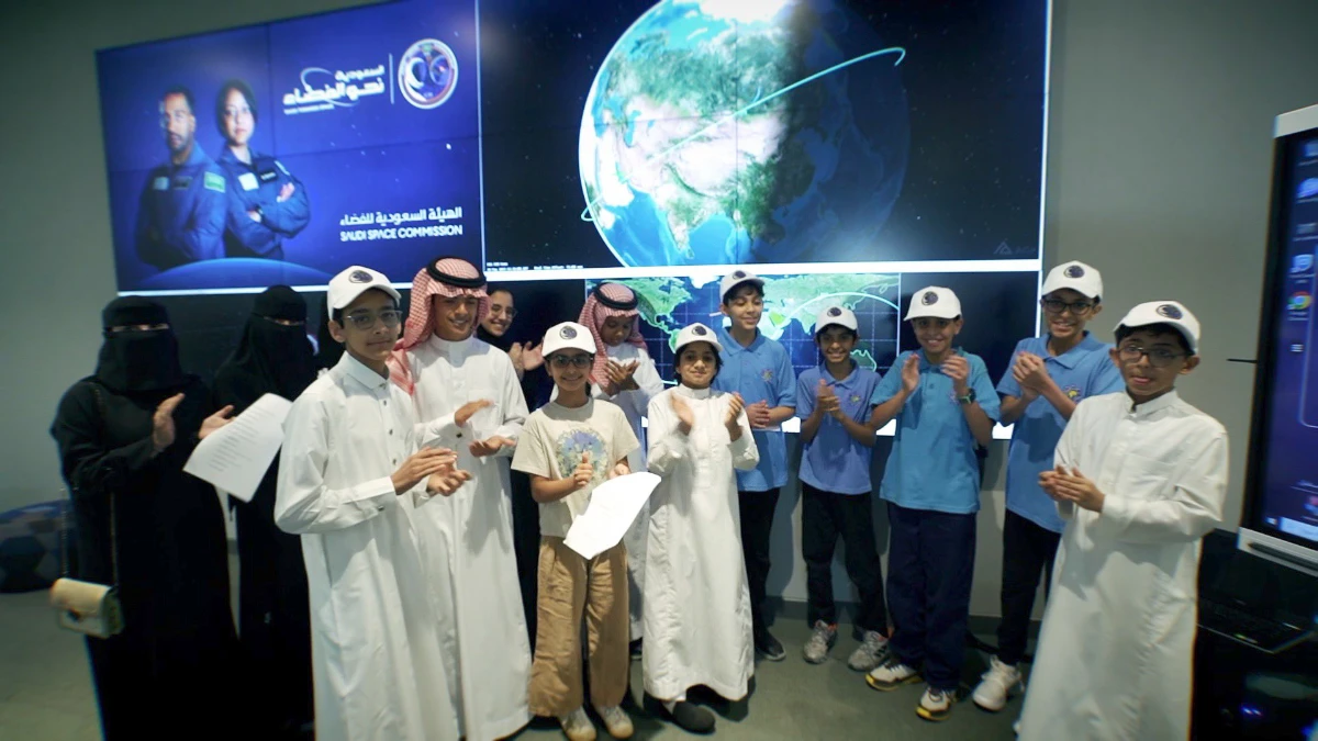 The two Saudi astronauts make radio contact with a group of Saudi students during the passage of the International Space Station over a ground station in Riyadh. (Twitter: @saudispace)