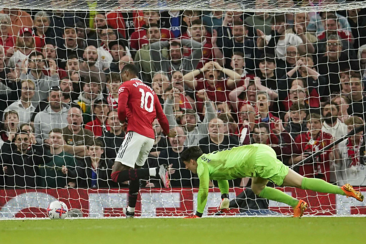 Chelsea's goalkeeper Kepa Arrizabalaga, right, fails to save the goal from Manchester United's Marcus Rashford during the English Premier League match between Manchester United and Chelsea at the Old Trafford stadium in Manchester, England, on Thursday. (AP)
