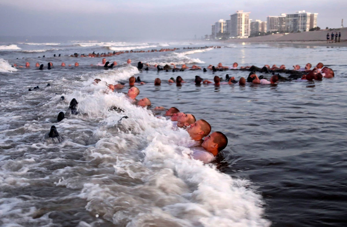 US Navy SEAL candidates participate in “surf immersion” during basic underwater demolition training in Coronado, California, on May 4, 2020. (US Navy via AP)