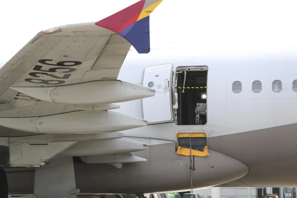 A passenger opened a door on an Asiana Airlines flight that later landed safely at a South Korean airport Friday, airline and government officials said. (AP)