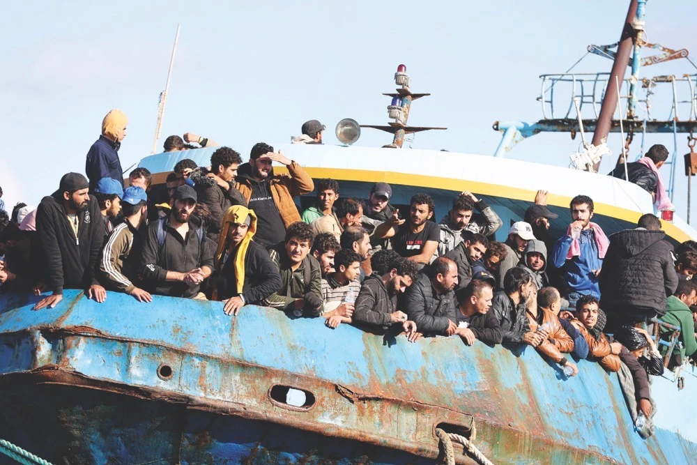 Migrants onboard a fishing boat at the port of Paleochora after a rescue operation off the island of Crete, Greece, on Nov. 22, 2022. (Reuters/File)