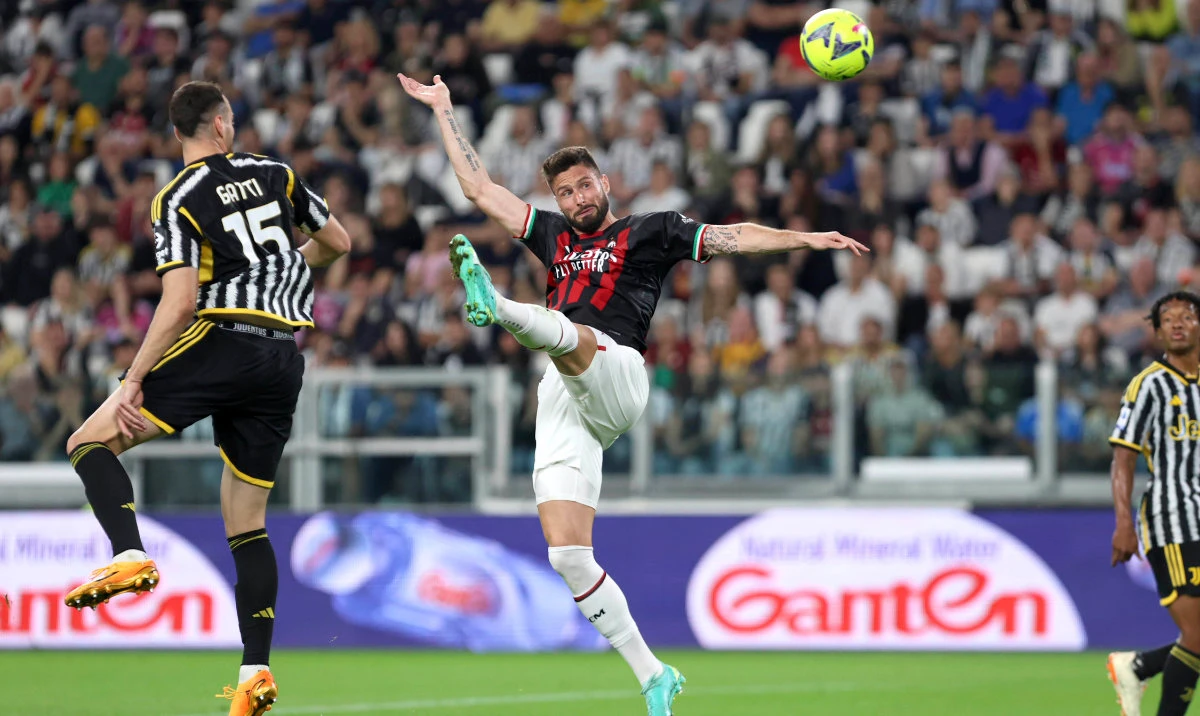 AC Milan's Olivier Giroud reaches for the ball for the ball during their Serie A match against Juventus at the Turin Allianz stadium, Italy, Sunday. Giroud scored the only goal in the match. (AP)