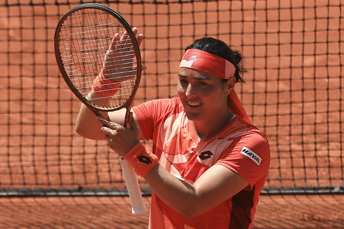 Tunisia’s Ons Jabeur celebrates winning her first round match of the French Open tennis tournament against Italy’s Lucia Bronzetti in two sets, 6-4, 6-1, at the Roland Garros stadium in Paris on May 30, 2023. (AP)