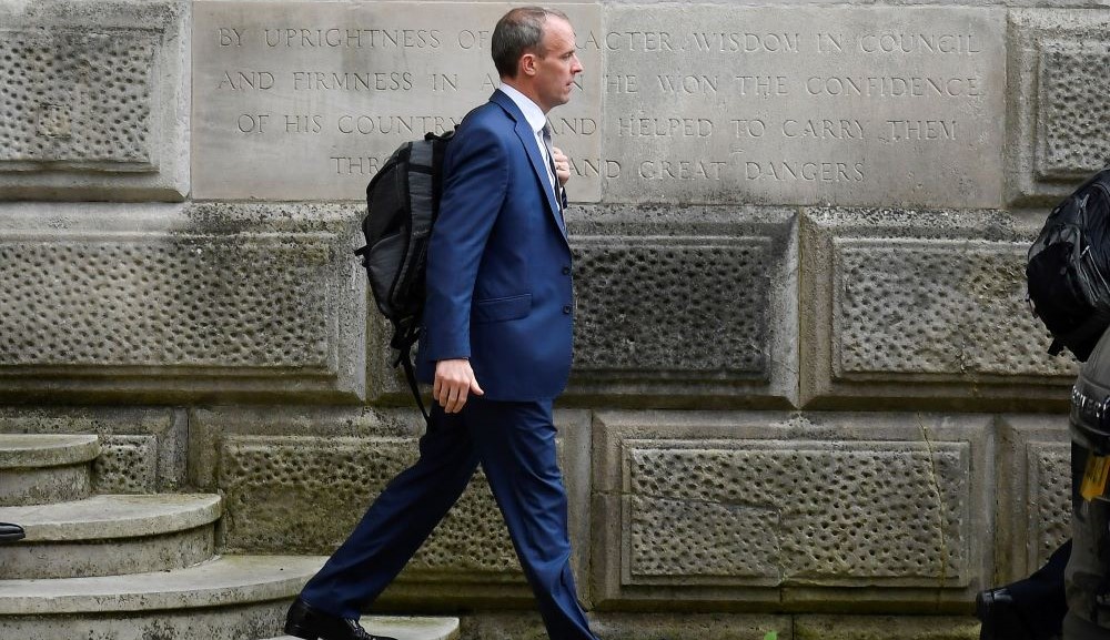 Britain’s Foreign Secretary Dominic Raab walks outside the FCDO in London, Sept. 15, 2021. (Reuters)