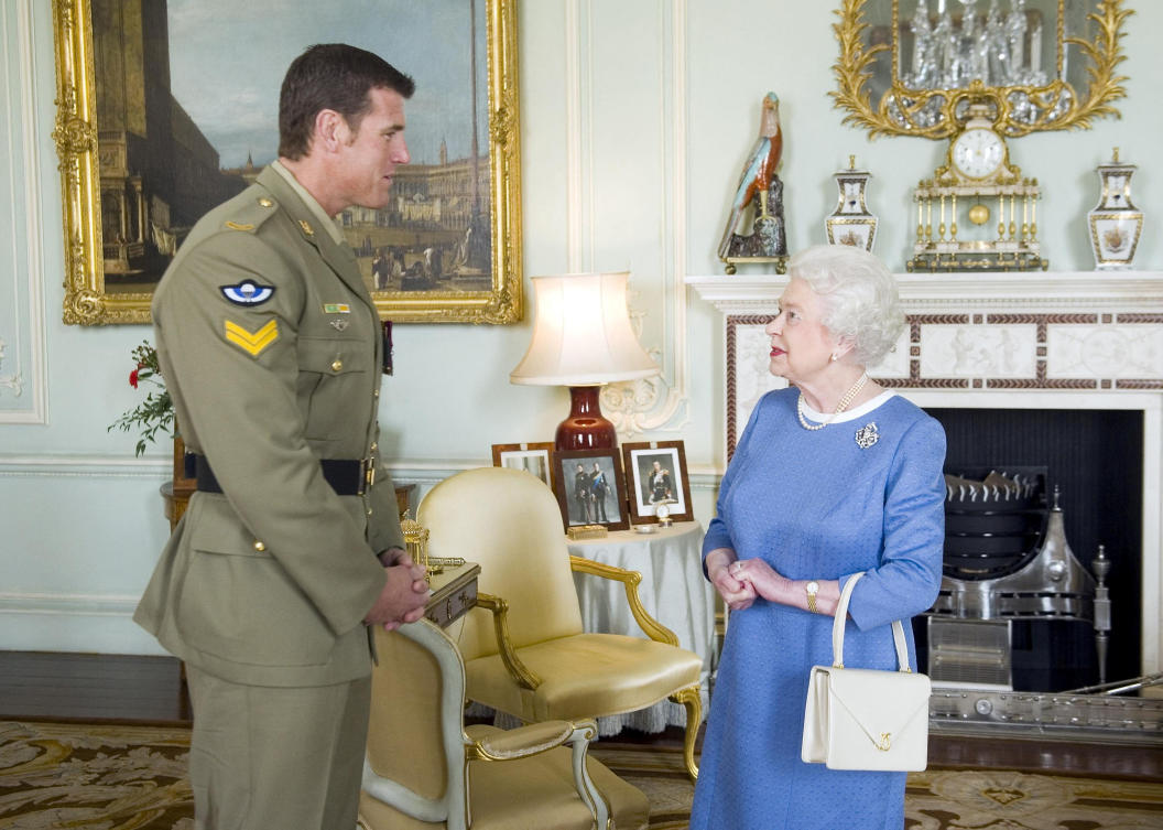 SAS corporal Ben Roberts-Smith won several top Australian military honors, including the Victoria Cross, for his actions during six tours of Afghanistan. Above, Roberts-Smith with Queen Elizabeth II during an audience at Buckingham Palace on Nov. 15, 2011. (Reuters)