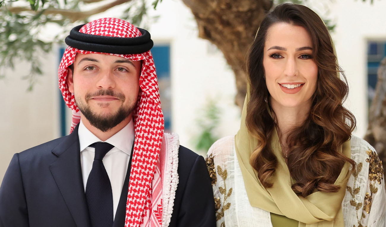 A handout picture released by the Jordanian Royal Palace shows Crown Prince Hussein, and his Saudi fiancée Rajwa Khaled bin Musaed bin Saif posing during their engagement ceremony in the Saudi capital Riyadh on August 17, 2022. (AFP/File)