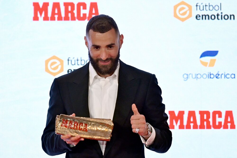 Real Madrid’s French forward Karim Benzema poses after receiving the MARCA Leyenda (MARCA Legend) award in Madrid on June 1, 2023. (AFP)
