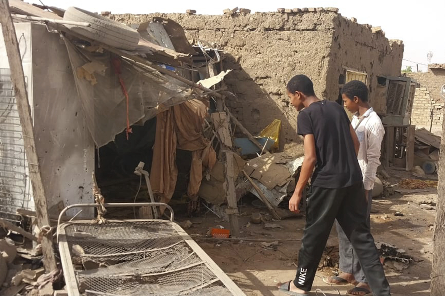 People check the rubble of their destroyed home after strikes at Allamat district in Khartoum, Sudan, Thursday, June 1, 2023. (AP)