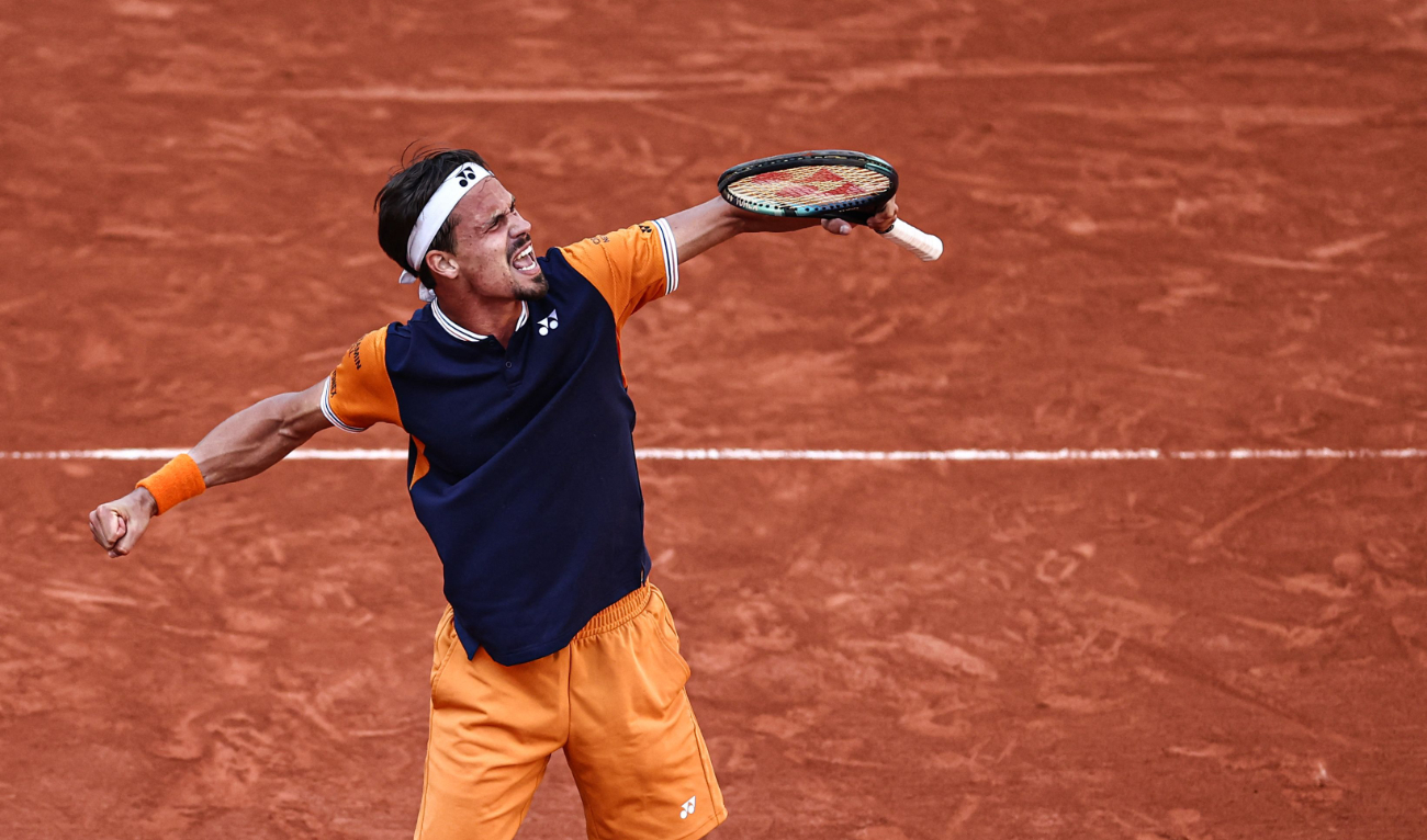 Germany’s Daniel Altmaier celebrates after winning against Italy’s Jannik Sinner at the end of their men’s singles match on day five of the Roland-Garros Open tennis tournament at the Court Suzanne-Lenglen in Paris on Thursday. (AFP)