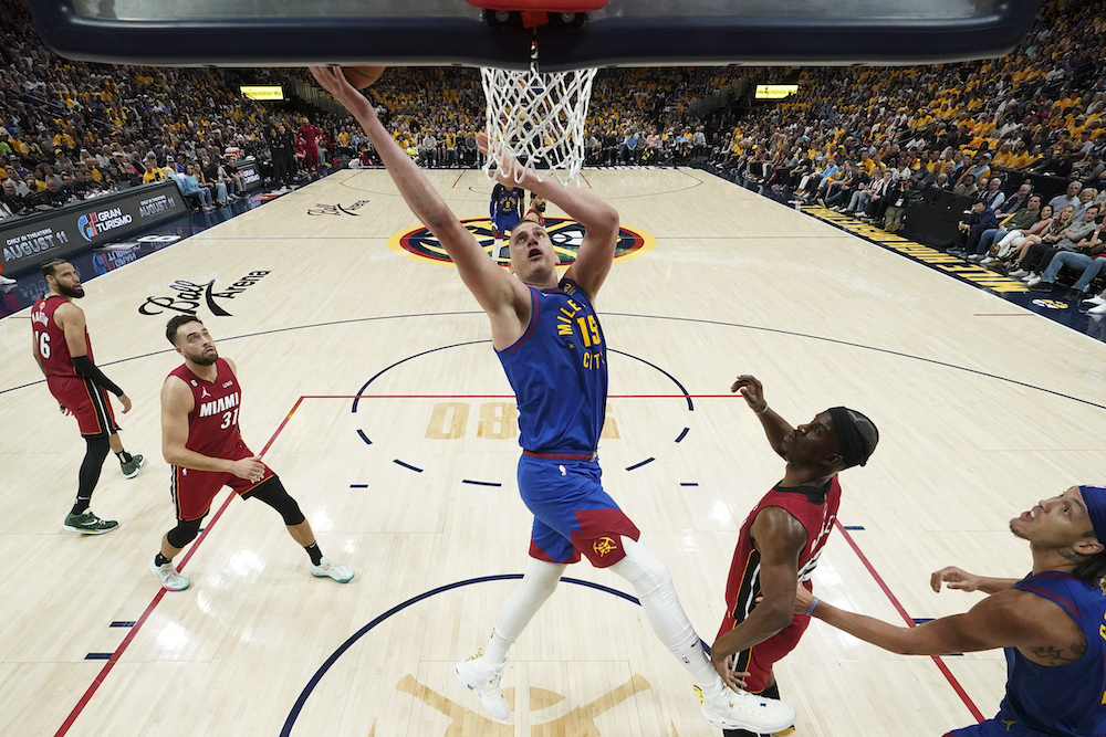Denver Nuggets center Nikola Jokic, center, shoots against the Miami Heat during the first half of Game 1 of basketball's NBA Finals Thursday in Denver. (AP)