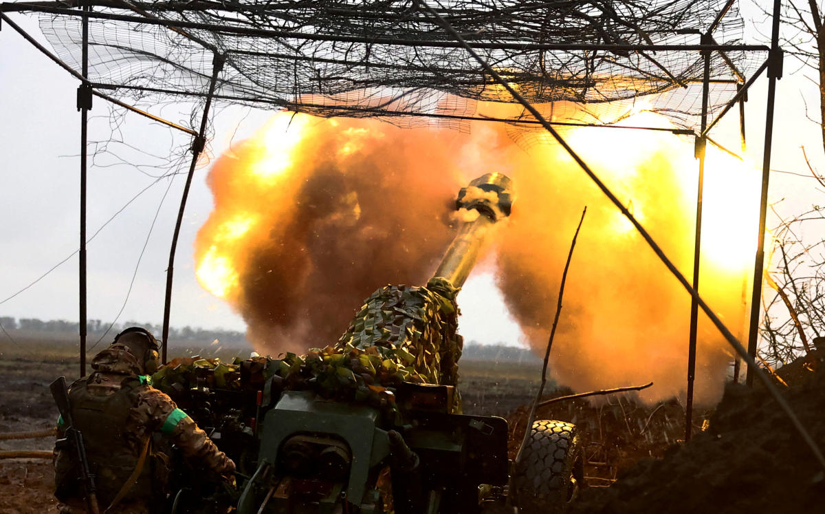 Above, Ukrainian artillery fires toward the frontline during heavy fighting near Bakhmut in Ukraine. Russian officials have reported intensified attacks from northern Ukraine. (Reuters)