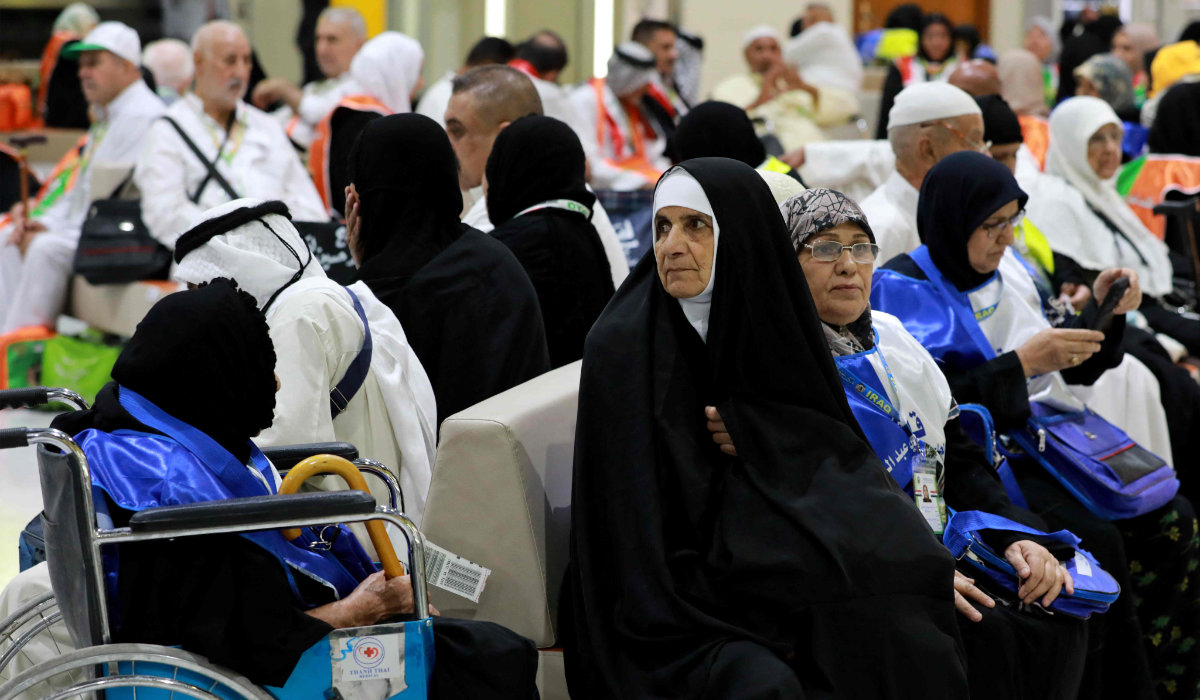 Muslim pilgrims wait at the airport in Baghdad on May 30, 2023 before leaving for the annual Hajj pilgrimage in the holy city of Makkah. (AFP)