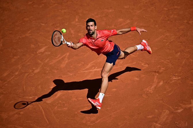 Serbia’s Novak Djokovic plays a forehand return to Spain’s Alejandro Davidovich Fokina during their men’s singles match of the Roland-Garros Open tennis tournament in Paris on Friday. (AFP)
