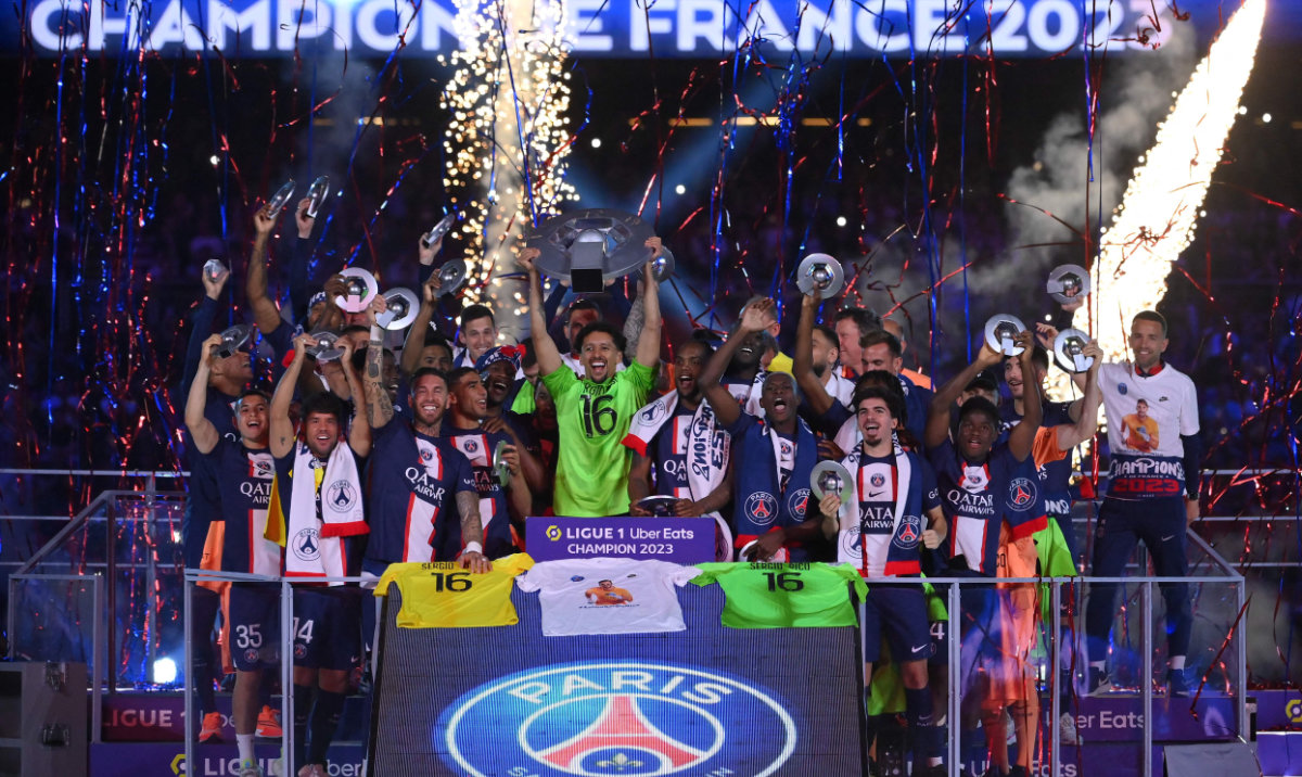 Paris Saint-Germain players celebrate their French L1 championship during the 2022-2023 Ligue1 trophy ceremony following the L1 match between Paris Saint-Germain (PSG) and Clermont Foot 63 at the Parc des Princes Stadium in Paris on Saturday. (AFP)