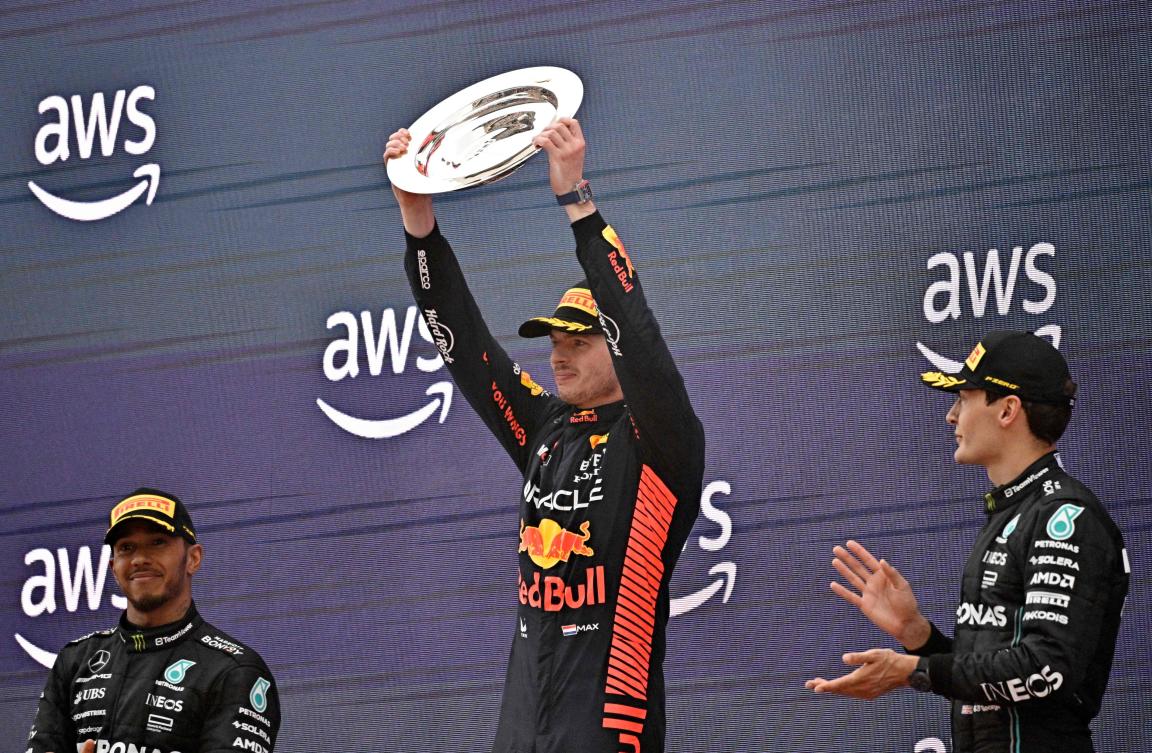 Red Bull’s Dutch driver Max Verstappen (C) celebrates his first place flaked by Mercedes’ British driver Lewis Hamilton (L) and Mercedes’ British driver George Russell on the podium of the Spanish Formula One Grand Prix race at the Circuit de Catalunya on June 4, 2023 in Montmelo, on the outskirts of Barcelona. (AFP)
