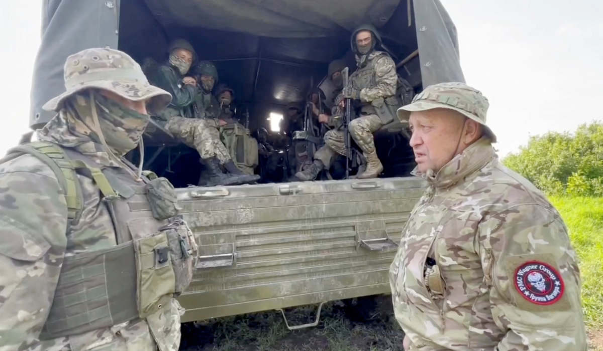Founder of Wagner private mercenary group Yevgeny Prigozhin speaks with servicemen during withdrawal of his forces from Bakhmut and handing over their positions to regular Russian troops, in the course of Russia-Ukraine conflict in an unidentified location, Russian-controlled Ukraine, in this still image taken from video released June 1, 2023. (REUTERS)